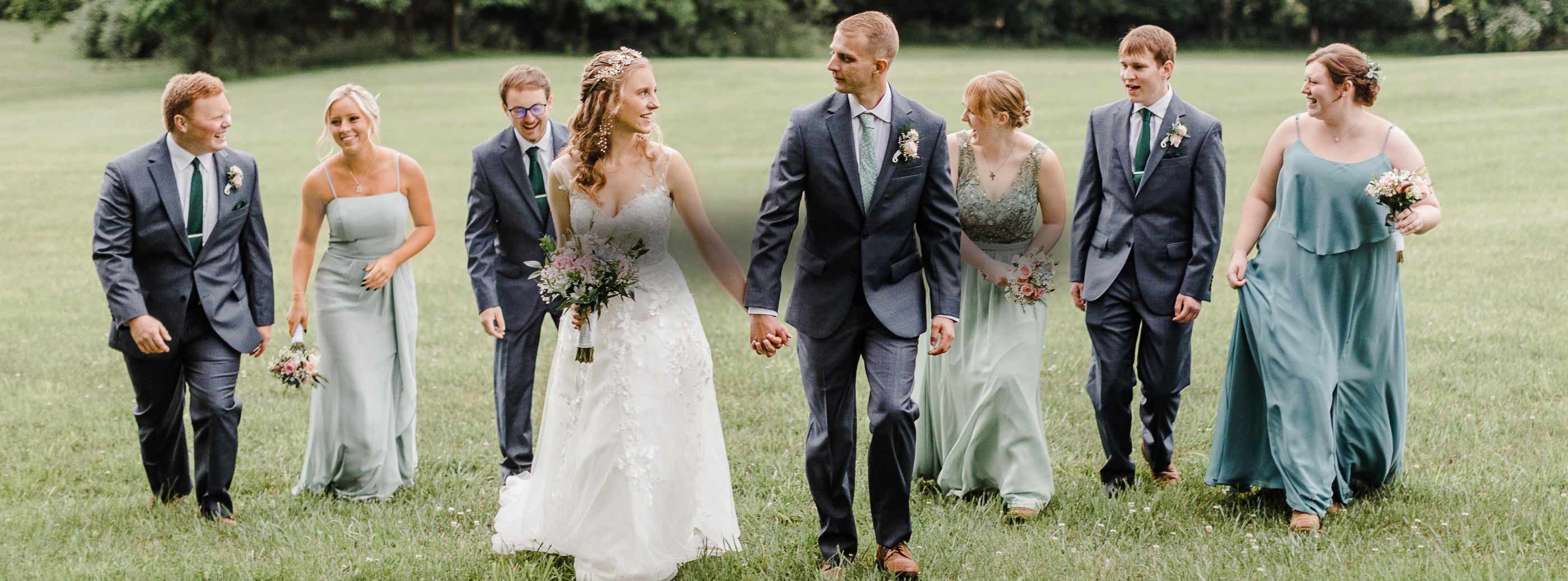 Models wearing a bridal gowns and suit