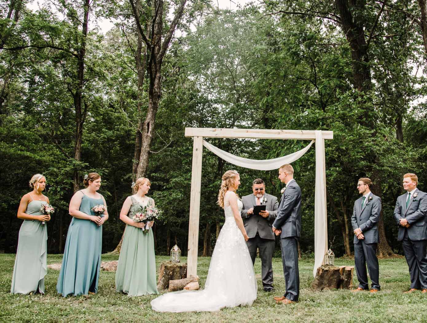 Сouple wearing a white gown and a gray suit