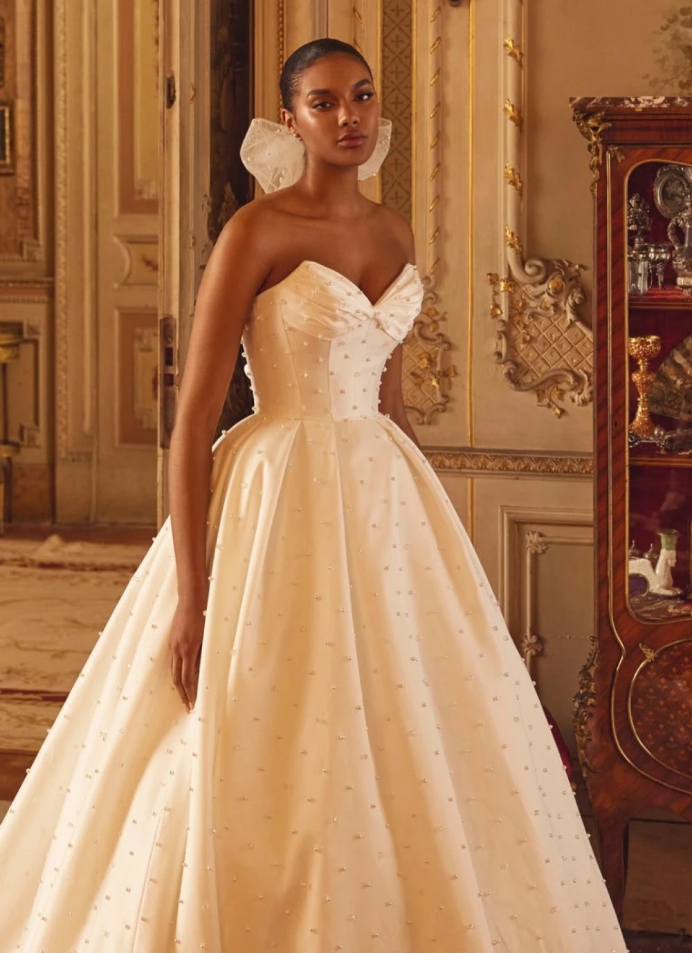 Model wearing a white gown