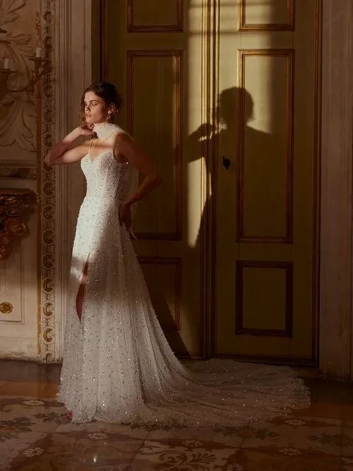 Model wearing a white gown