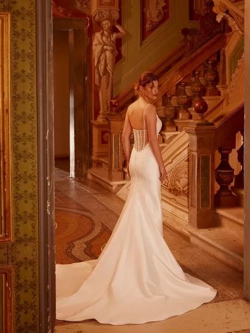Model wearing a white gown