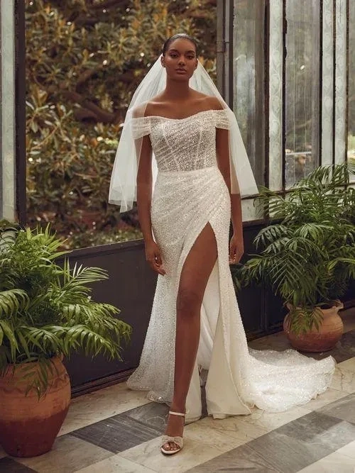 Model wearing a white gown
