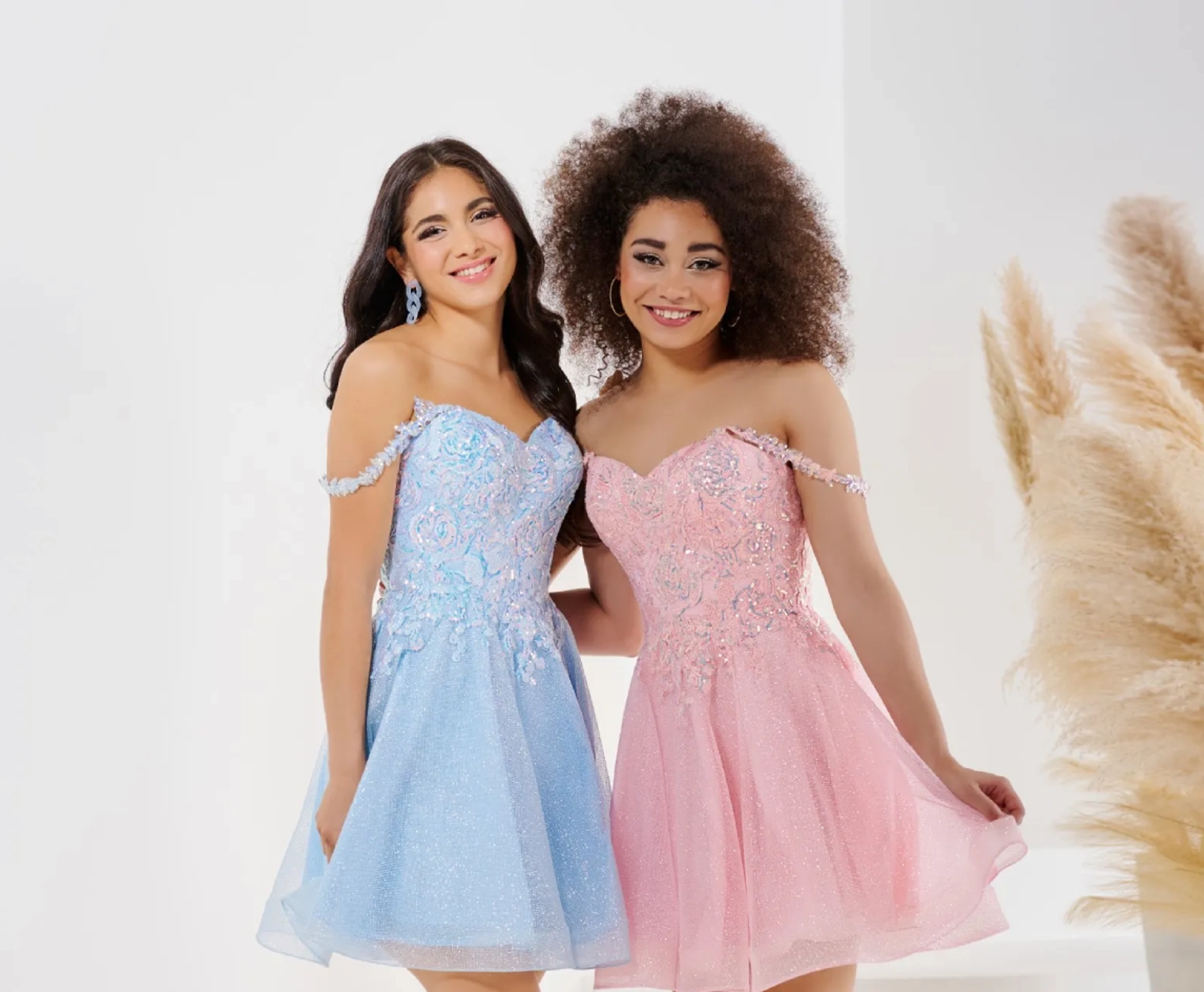 Models wearing a homecoming dresses. Mobile image